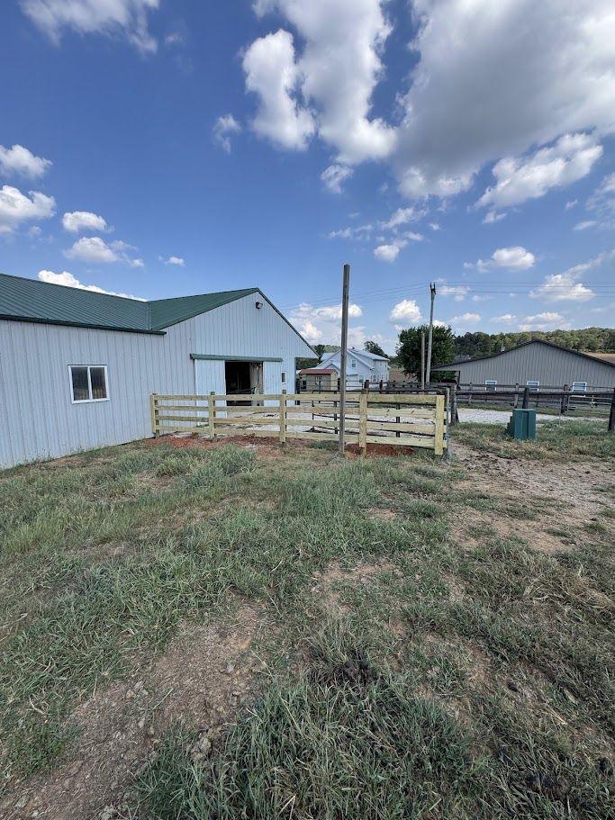 Four-board farm fence