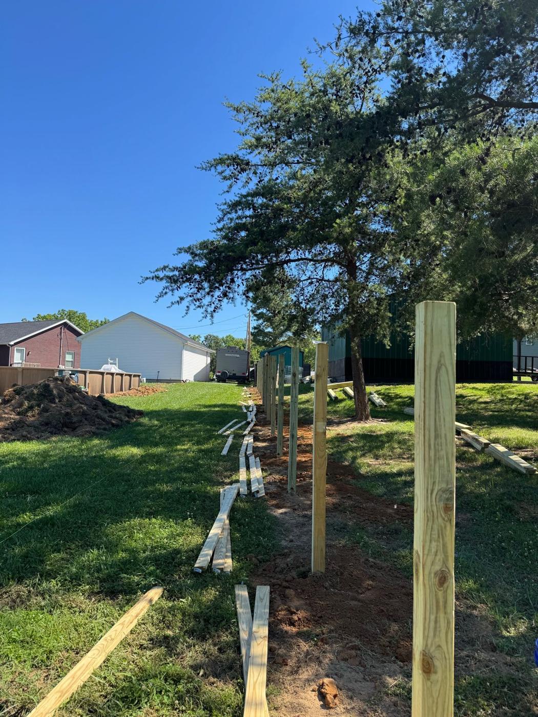 Fence posts set in concrete