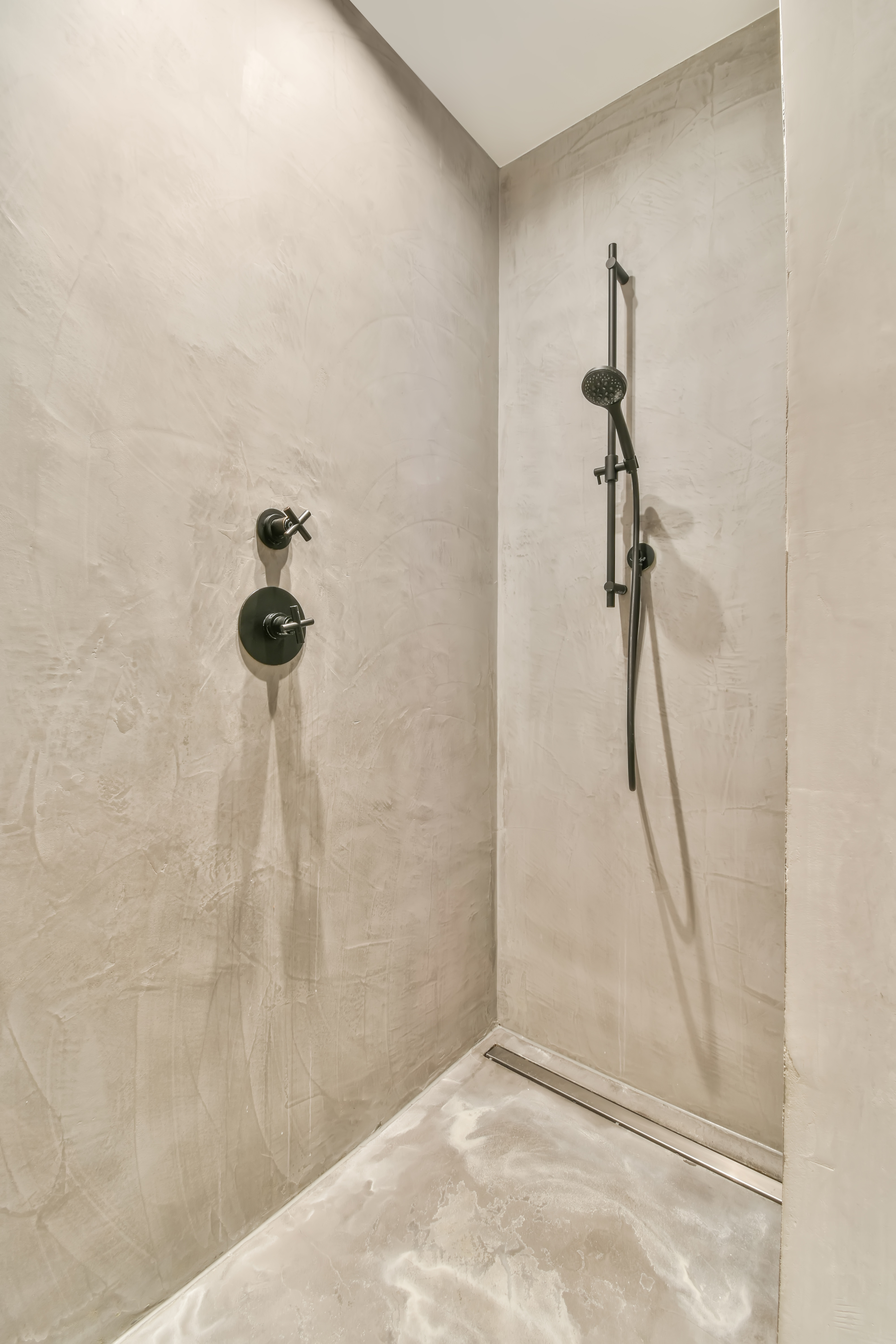 Microcement bathroom with LED recessed lighting