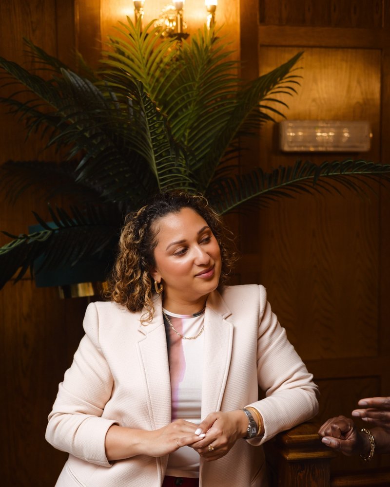 A founder in conversation in a wood-panelled room at a Founders Freedom gathering
