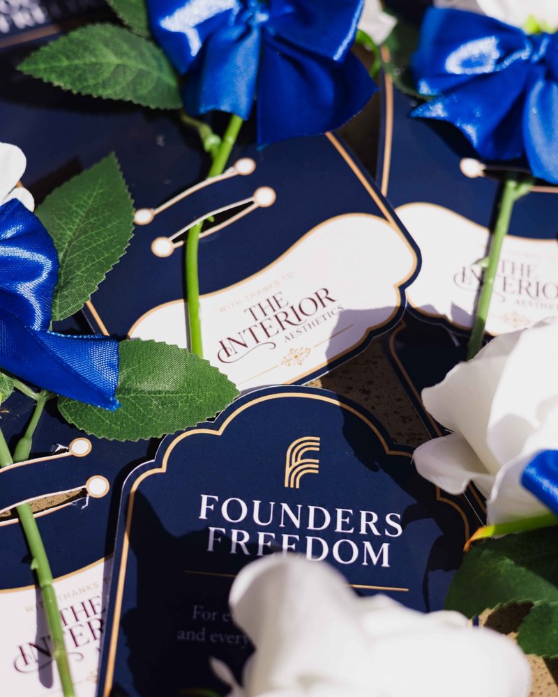 Roses tied with blue bows and Founders Freedom gift tags
