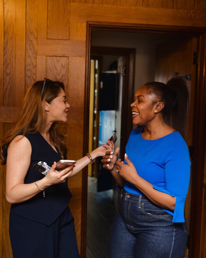 Two founders talking by a doorway at a Founders Freedom evening