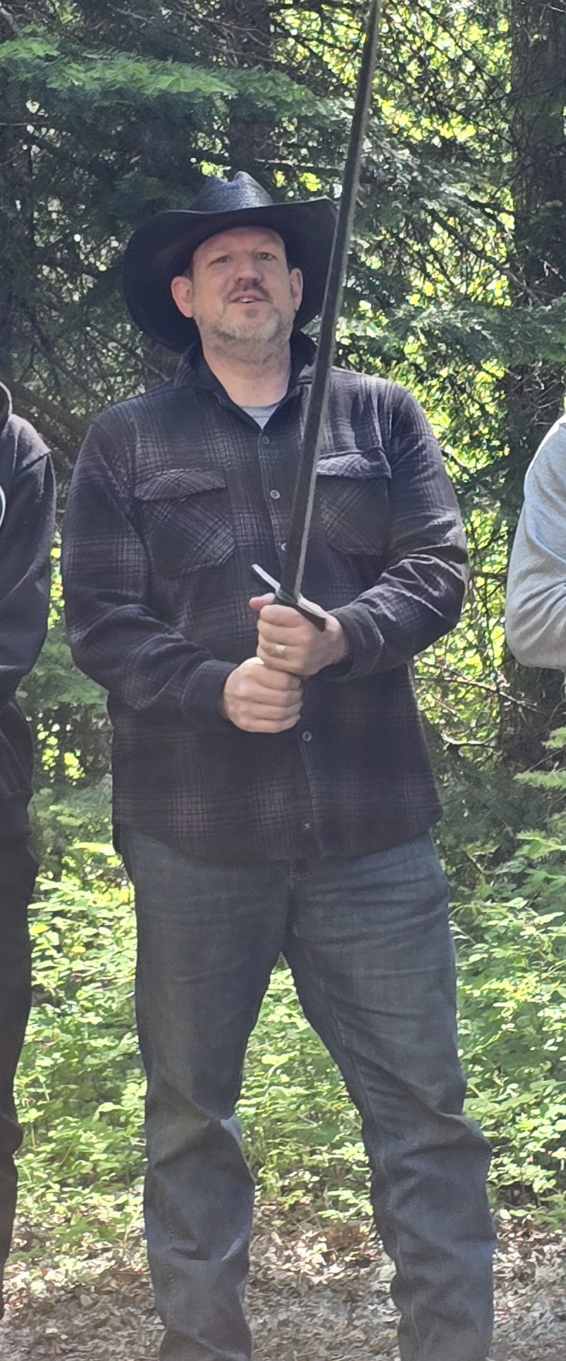 Philip Brittain holding a sword