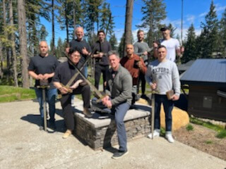 Victory training group beside a cabin