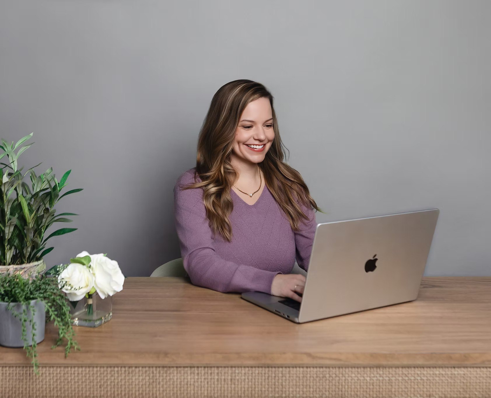 Natasha Myers working at her laptop