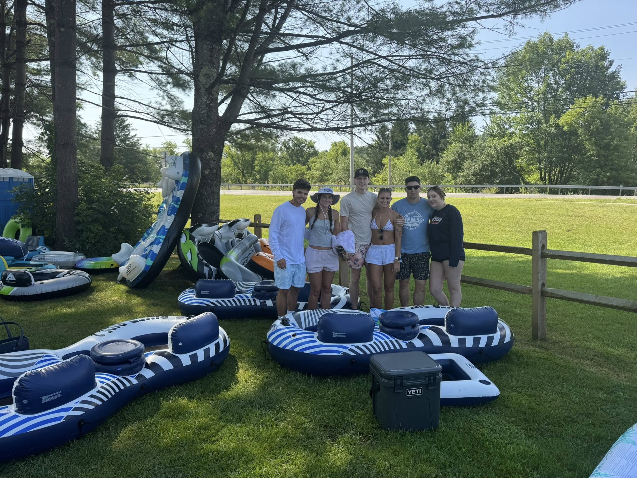 Group of guests standing with premium river tubes ready to launch at West Canada Creek Tubing in Poland NY