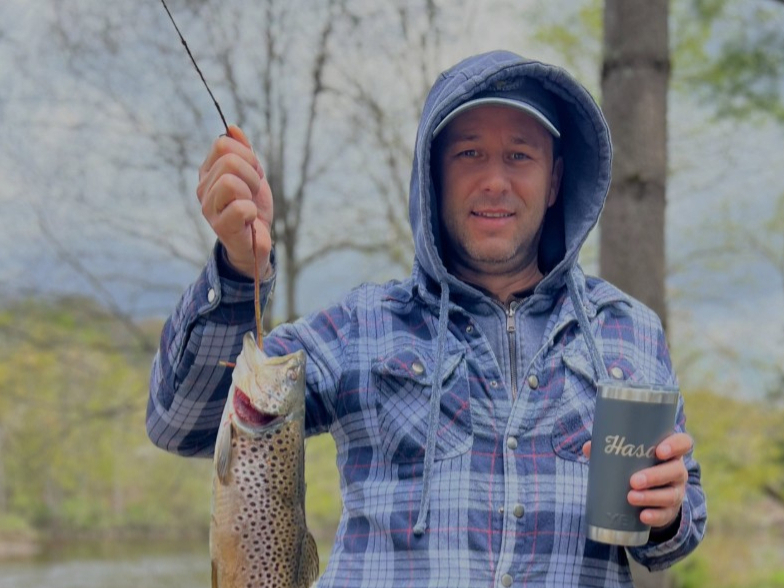 Camper trout fishing on West Canada Creek at West Canada Creek Campground