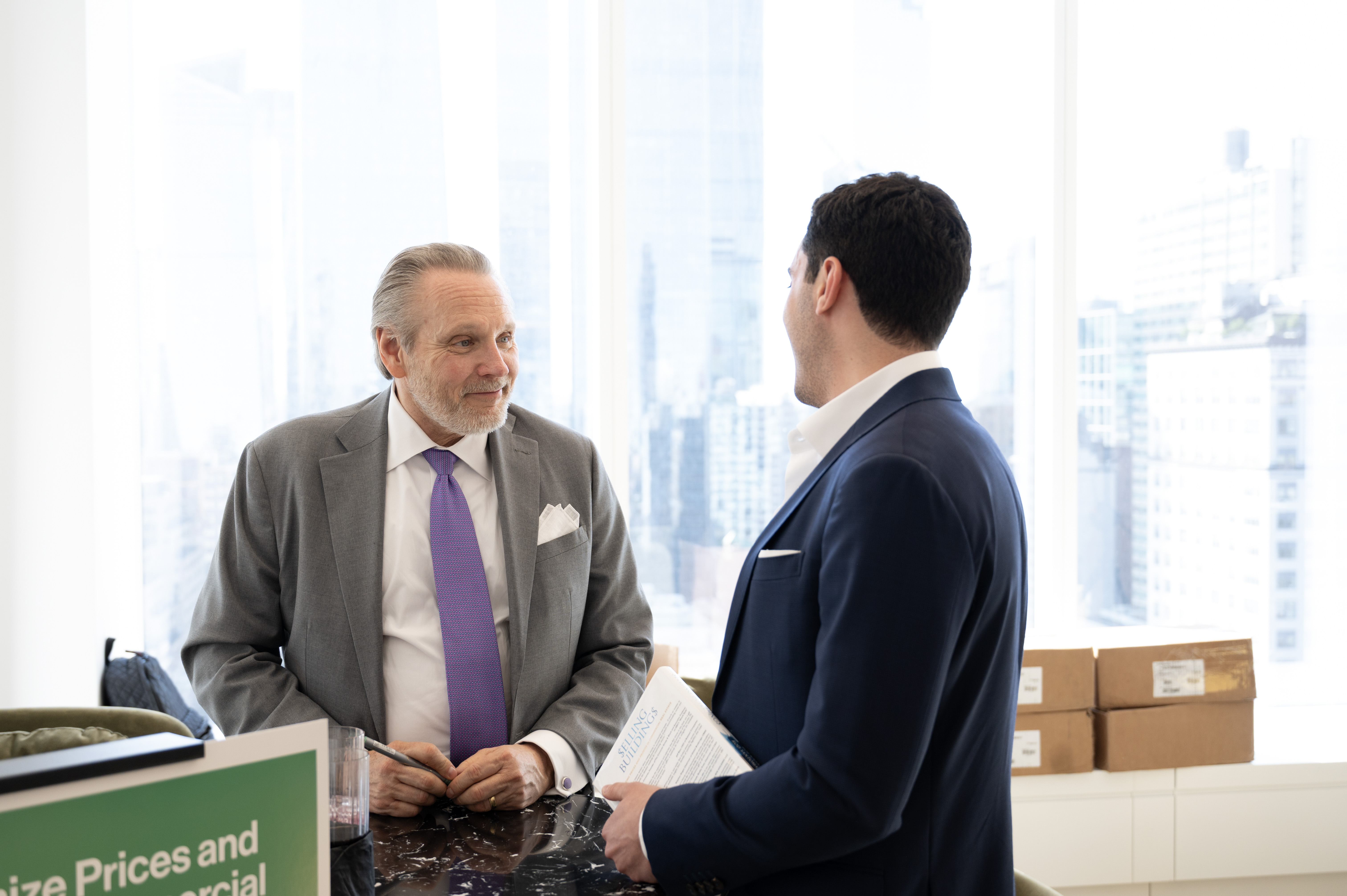 Bob Knakal in conversation with a member