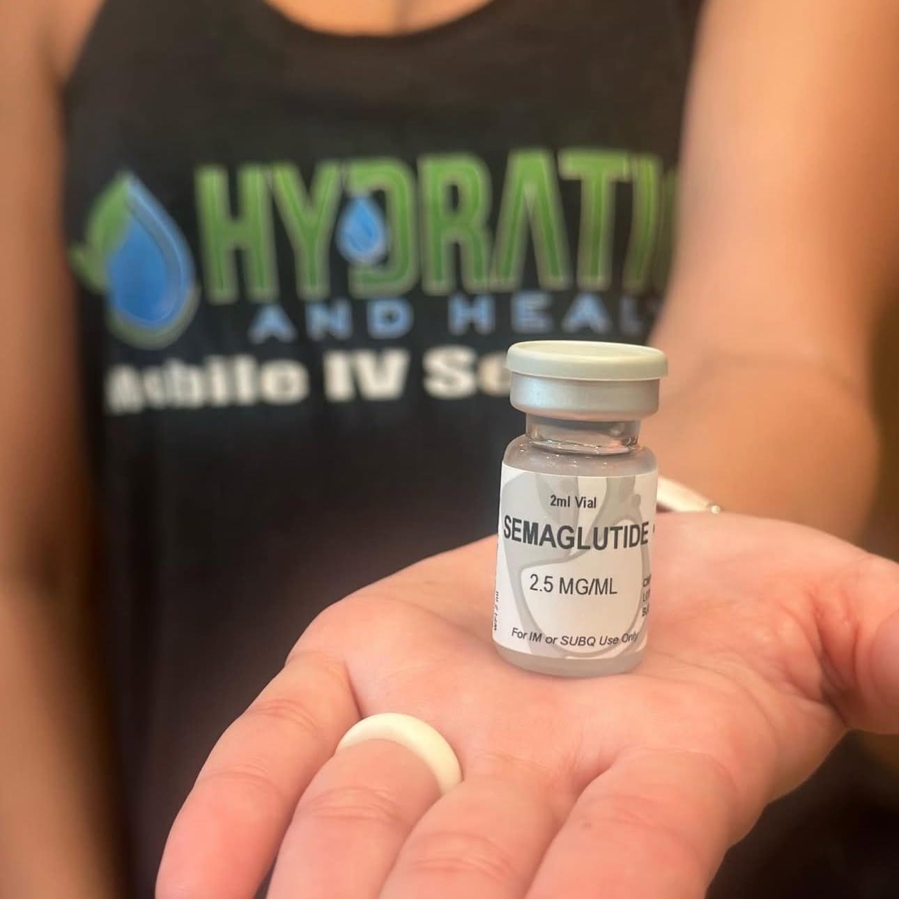 Nurse Mia holding a vial of compounded semaglutide for medical weight management