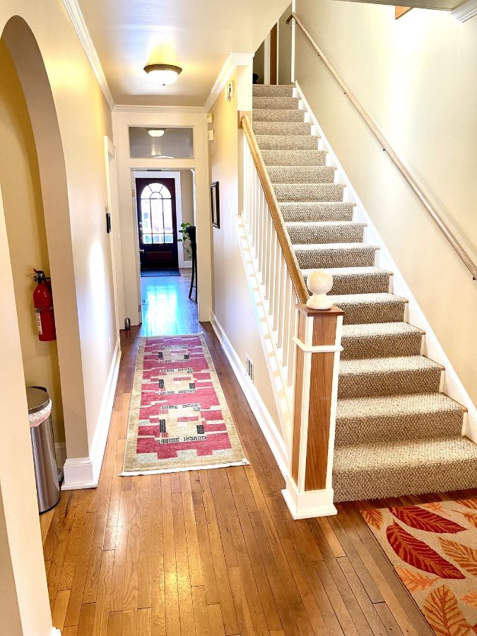 Hardwood stair hall at The 440 with the staircase to the second-floor suites