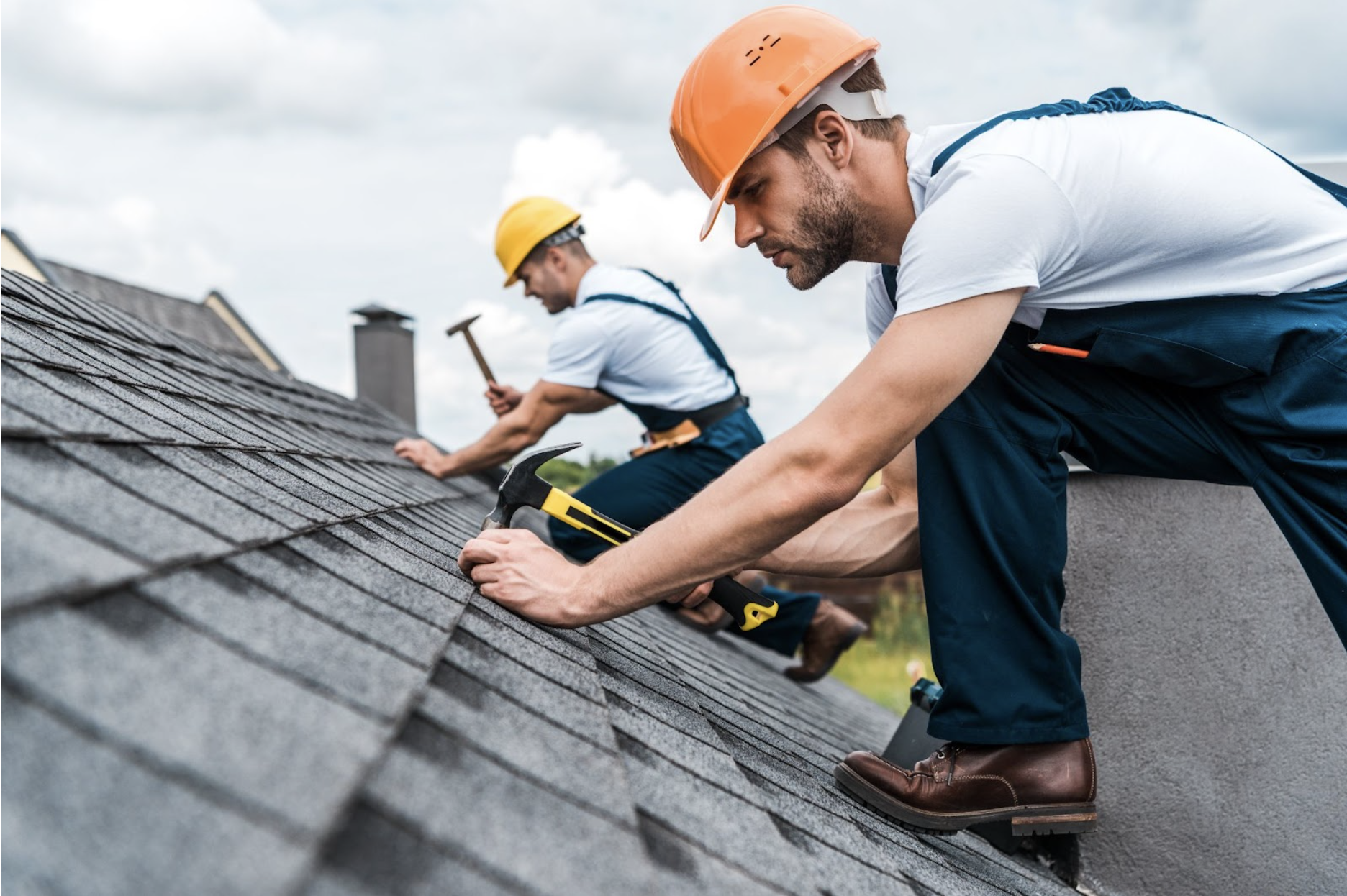 Roofing professionals installing shingles
