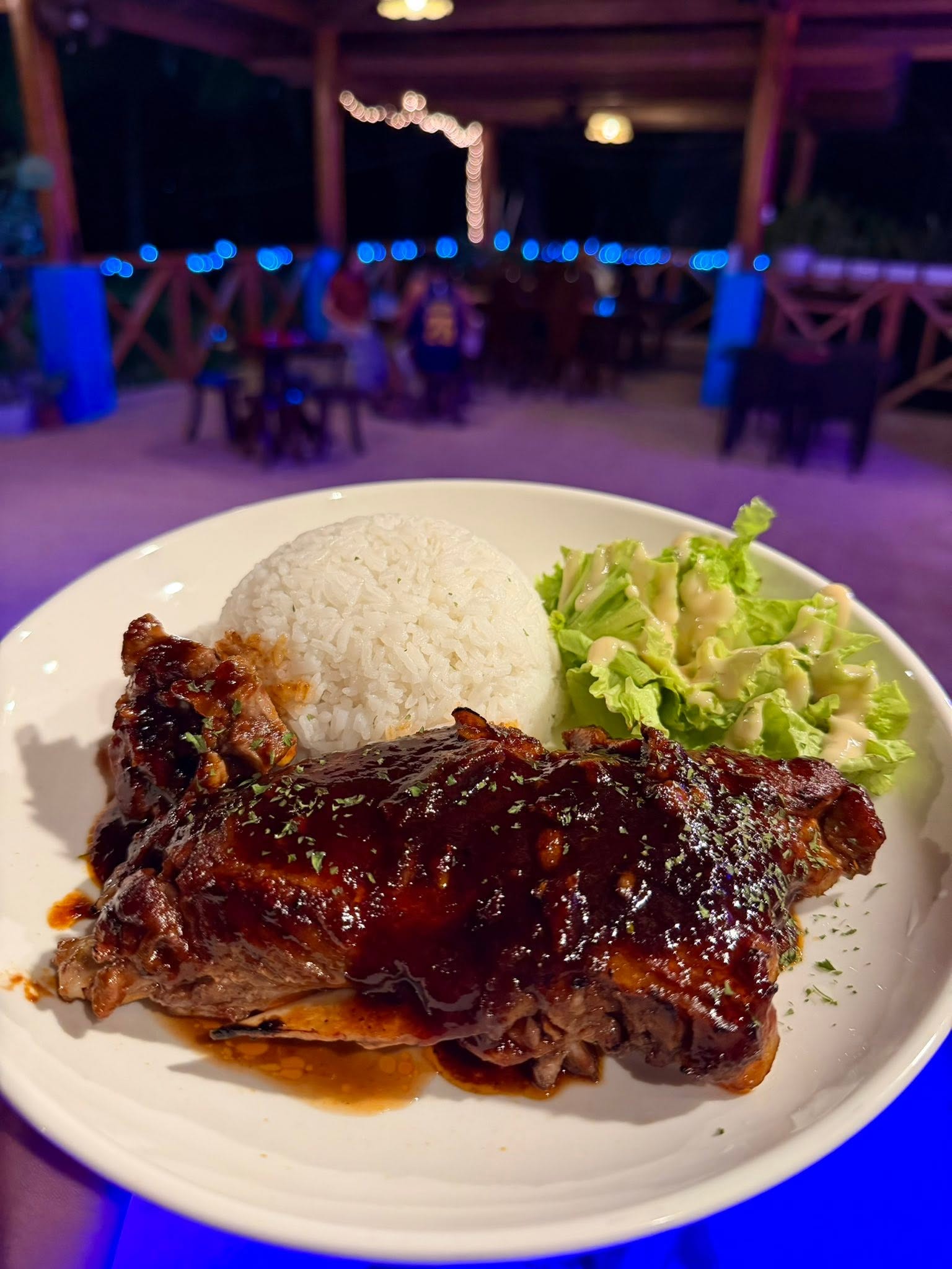 Glazed grilled entrée served with rice and vegetables