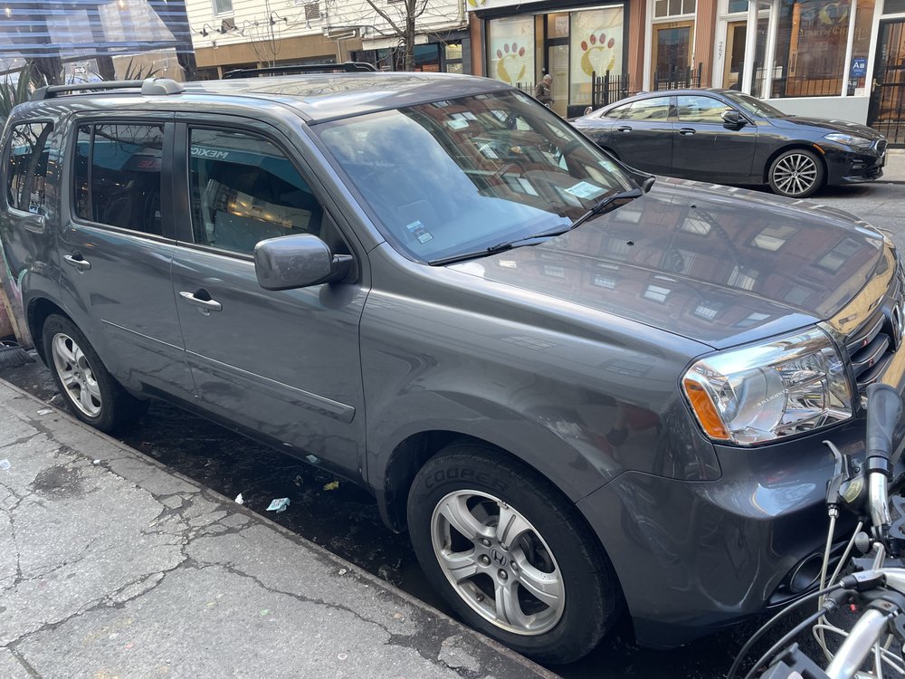 Grey SUV photographed following repair