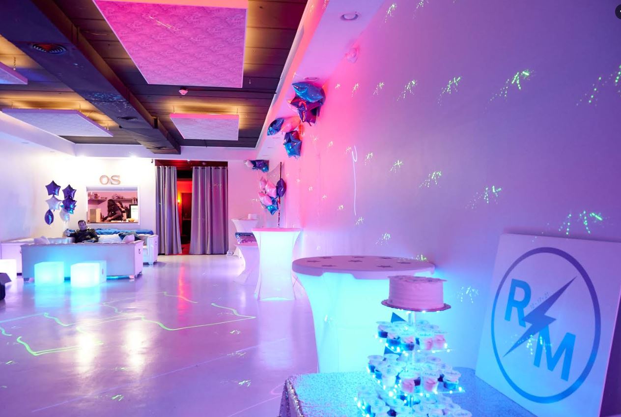 Colorful lighting and a personalized party setting