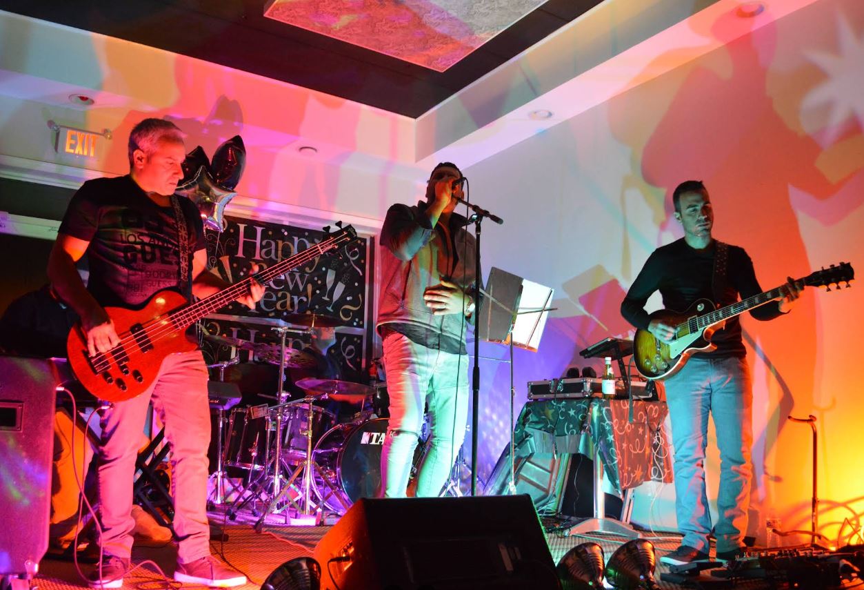 Live musicians performing with colorful projections
