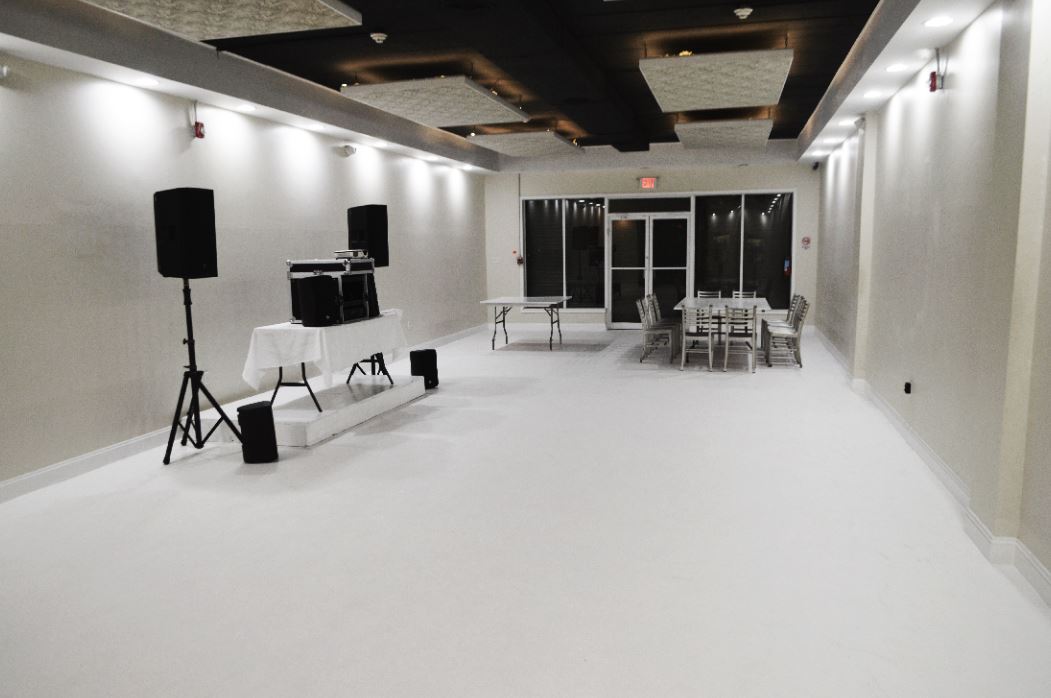 The venue interior with sound equipment and an open floor