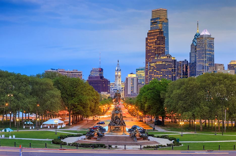 Philadelphia skyline beyond the tree-lined parkway