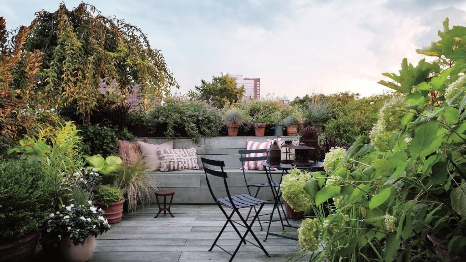 Terrace garden with container planting and bistro seating — outdoor living by Oak and Stone Landscaping