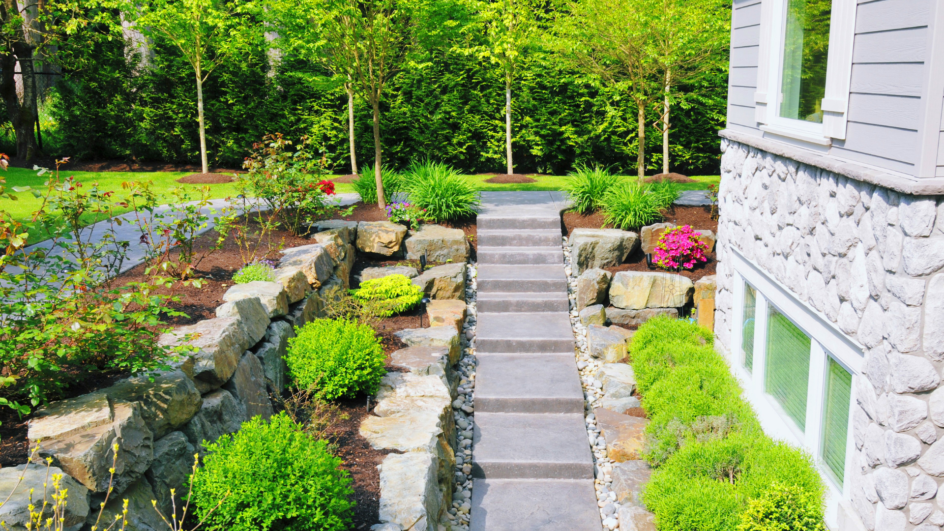 Stone steps and retaining walls with layered planting — hardscaping by Oak and Stone Landscaping in Greater Sacramento