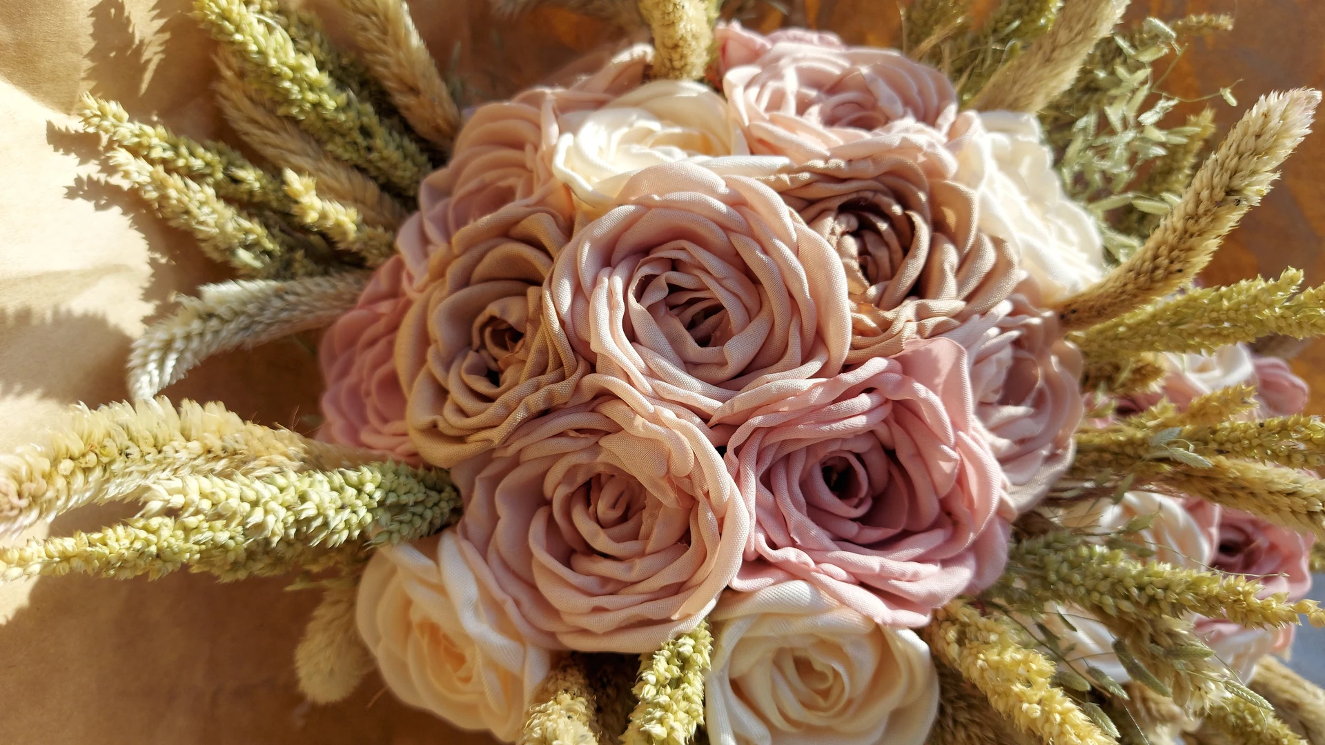 Romantic neutral rose bouquet with wheat-textured accents created by 11th Street Bouquets