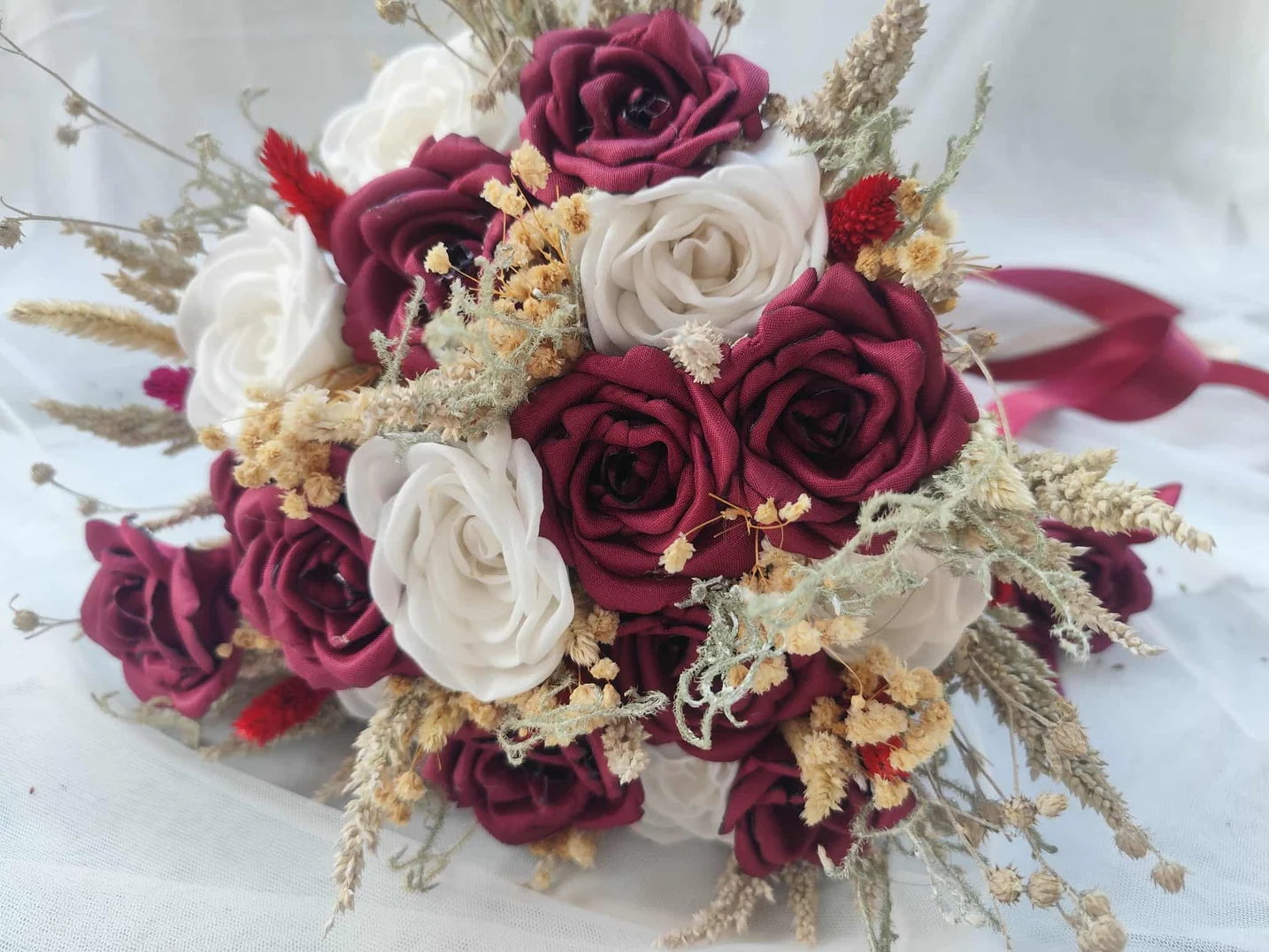 Queen bouquet featuring bold burgundy and ivory roses
