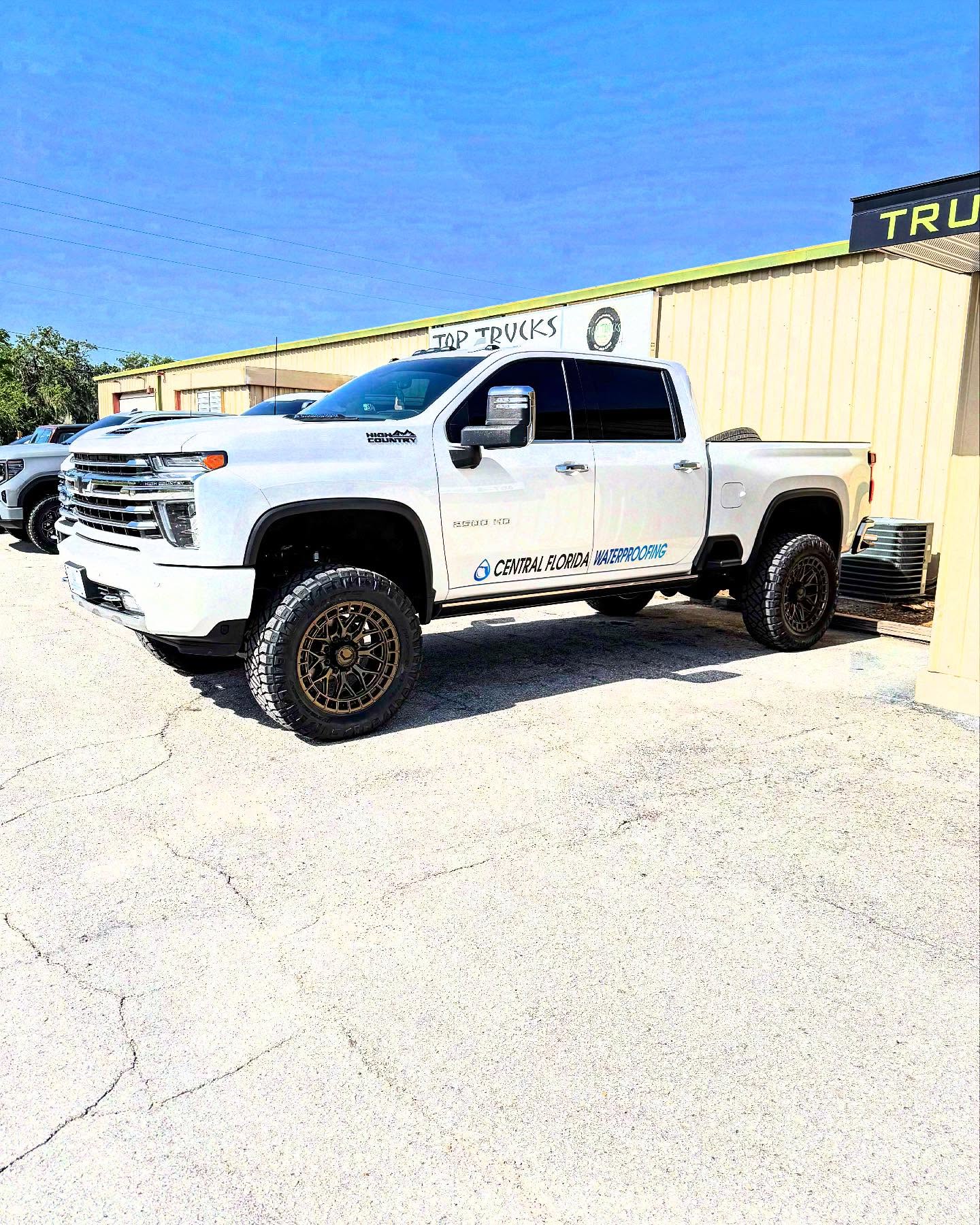 Silverado 2500HD High Country on bronze wheels, built at Top Trucks of Central Florida in Longwood, FL