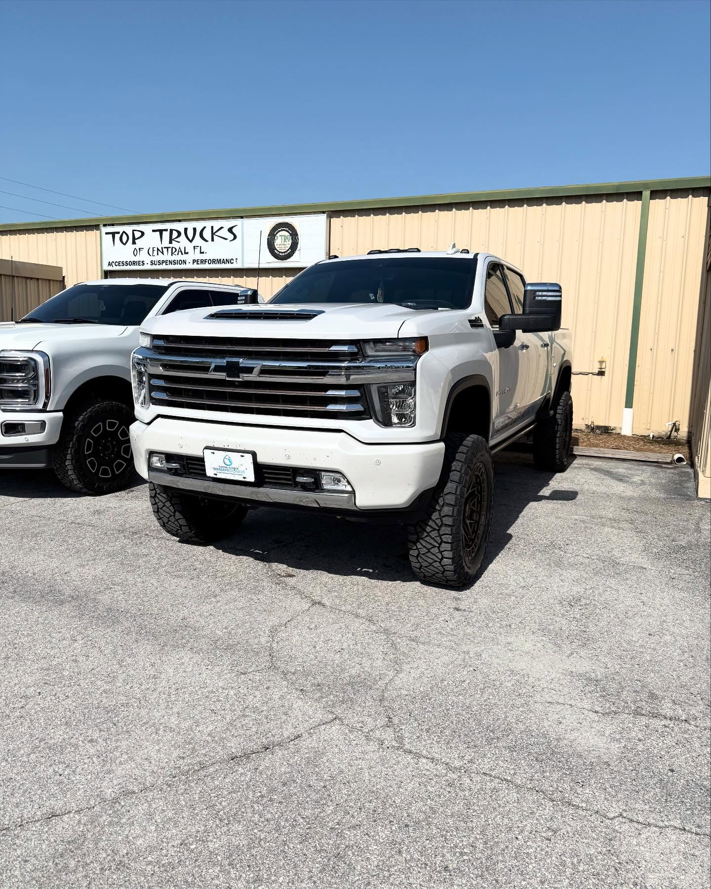 Silverado 2500HD High Country on bronze wheels, built at Top Trucks of Central Florida in Longwood, FL