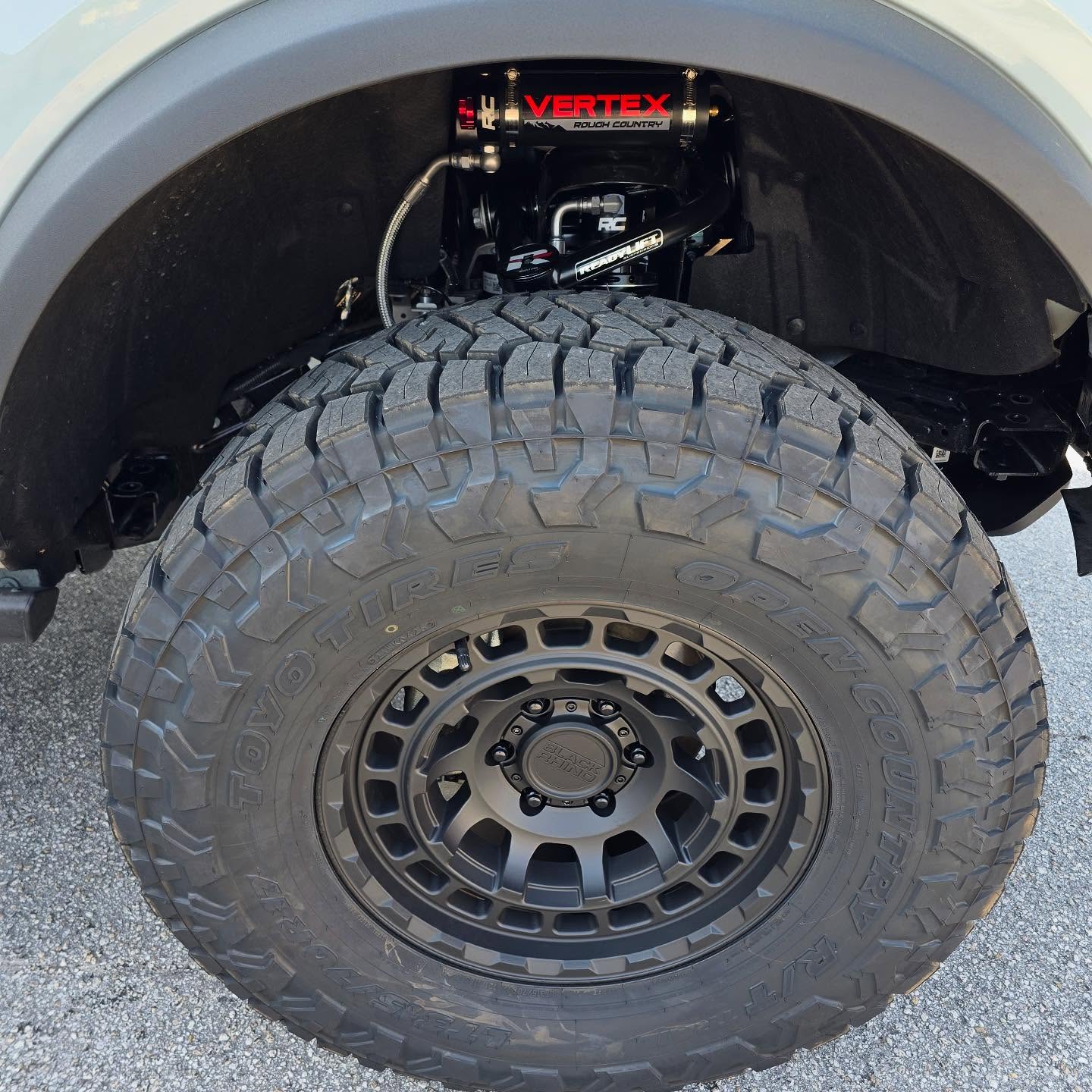 Black off-road wheel and tire on a lifted truck