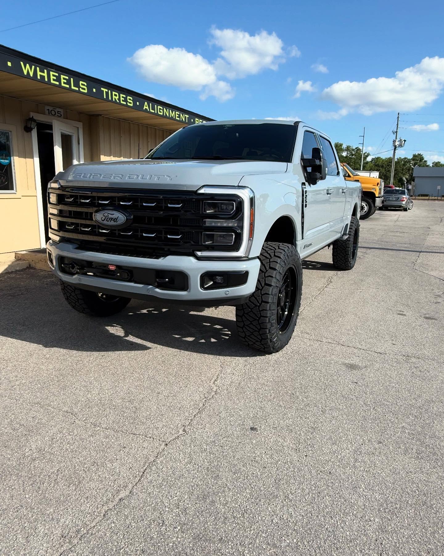 Lifted white Ford Super Duty