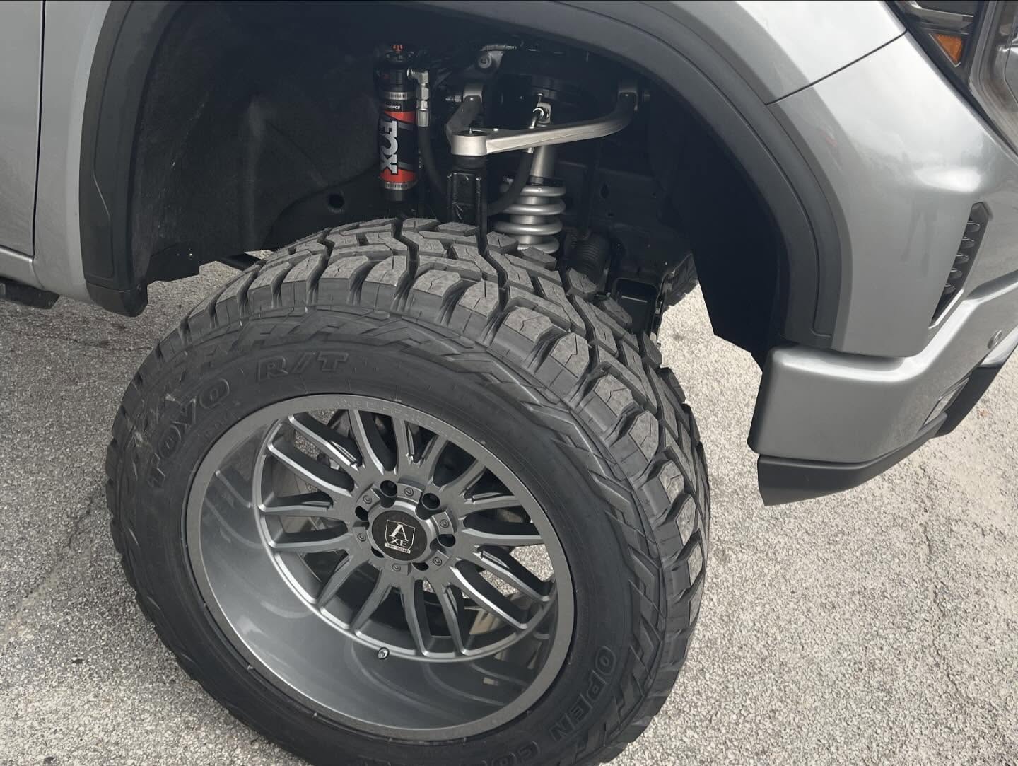 Shock and suspension behind an off-road tire