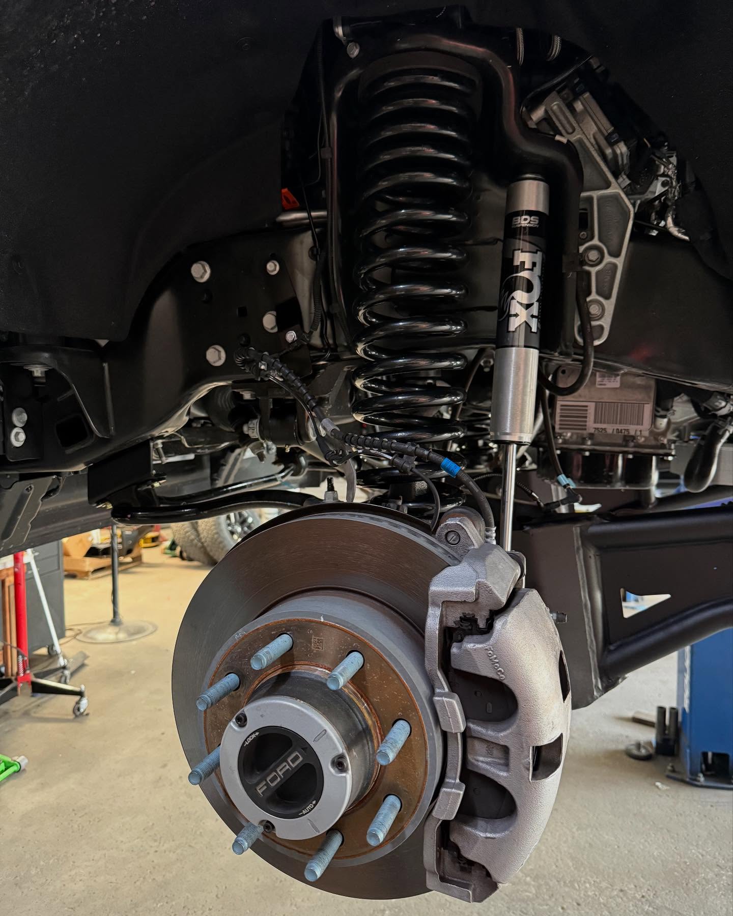 Coilover and front suspension close-up on a lifted truck