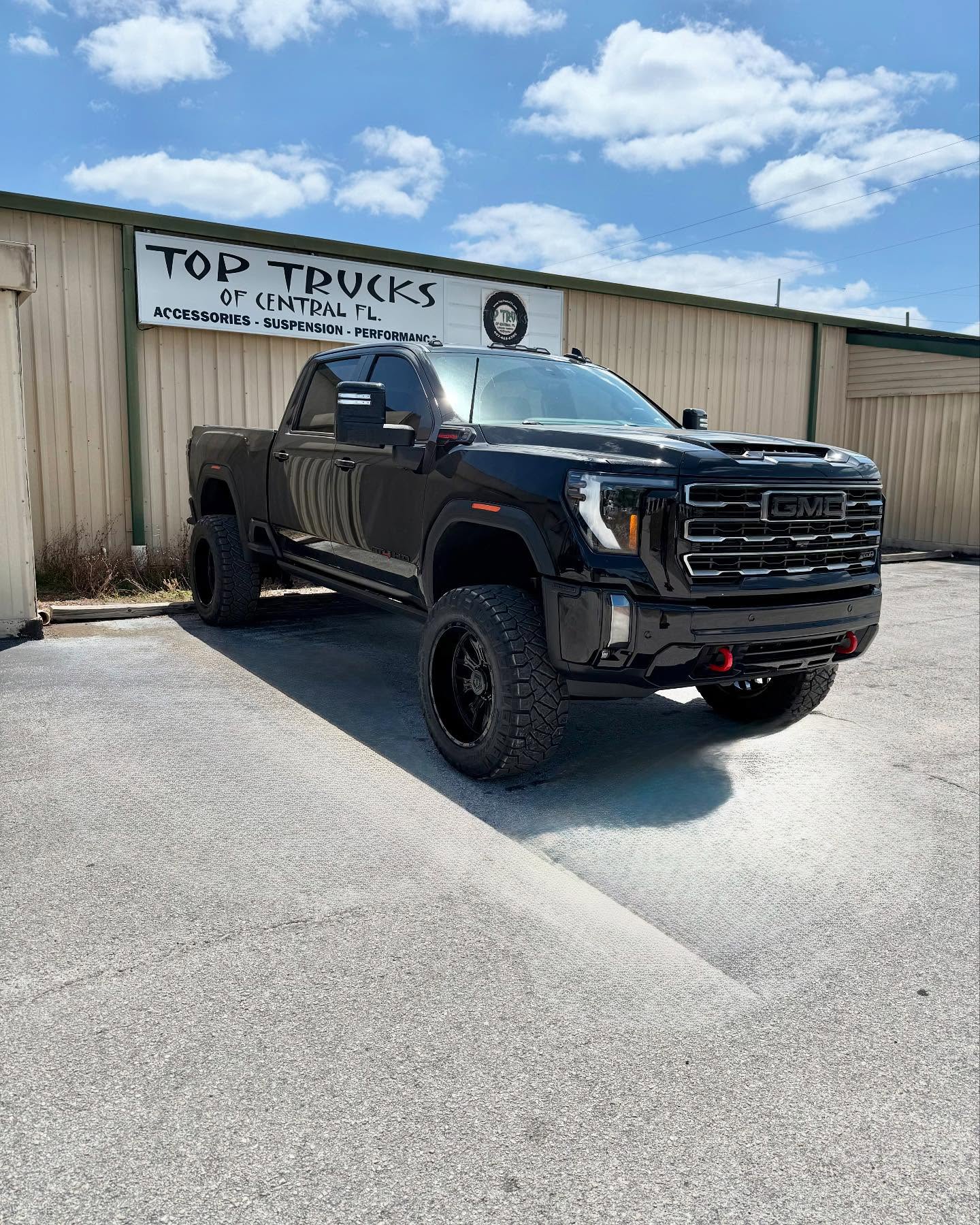 Lifted GMC Sierra 2500 Denali HD, built at Top Trucks of Central Florida in Longwood, FL