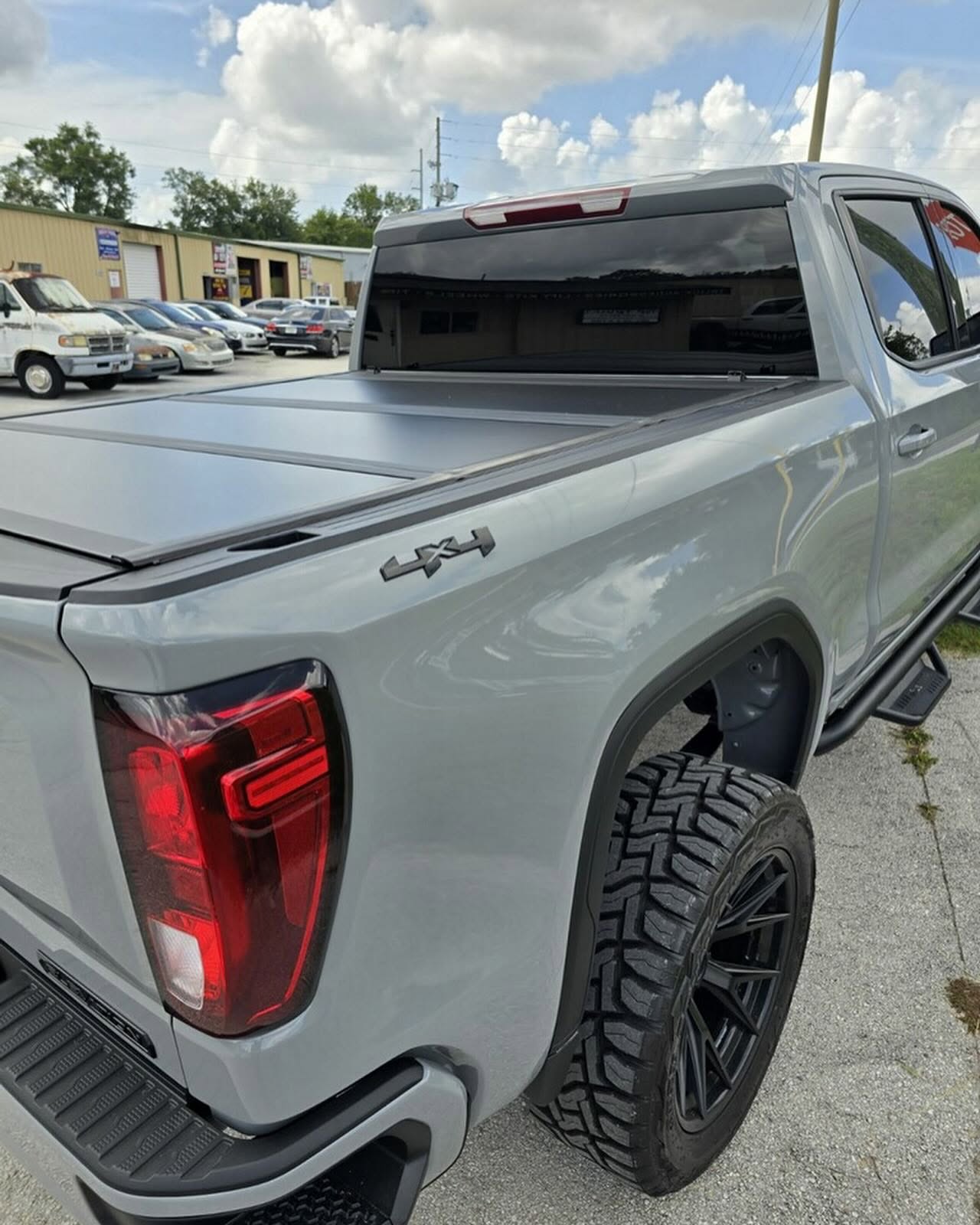 Tonneau cover on a 4x4 bed, built at Top Trucks of Central Florida in Longwood, FL