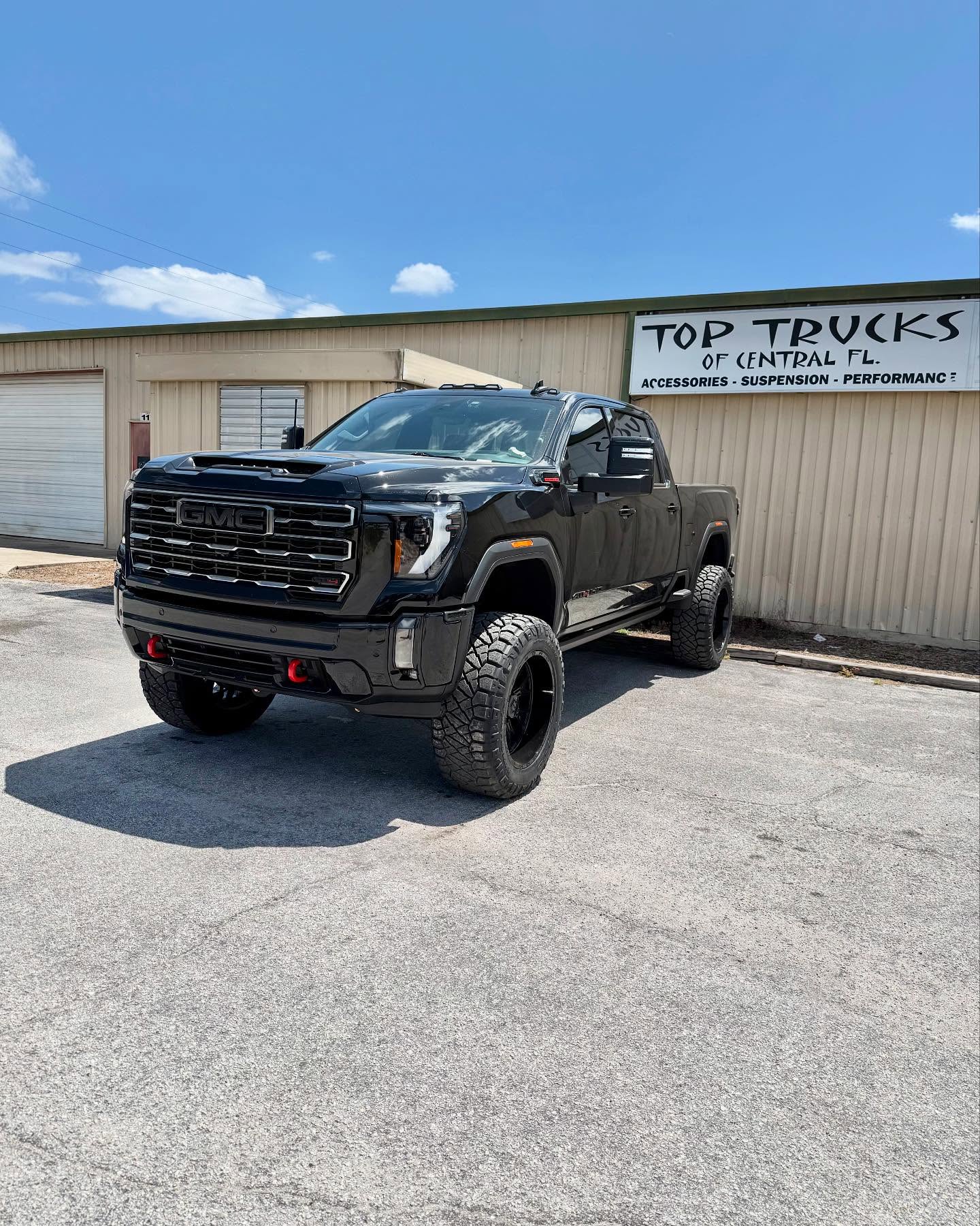 Lifted GMC Sierra 2500 Denali HD, built at Top Trucks of Central Florida in Longwood, FL