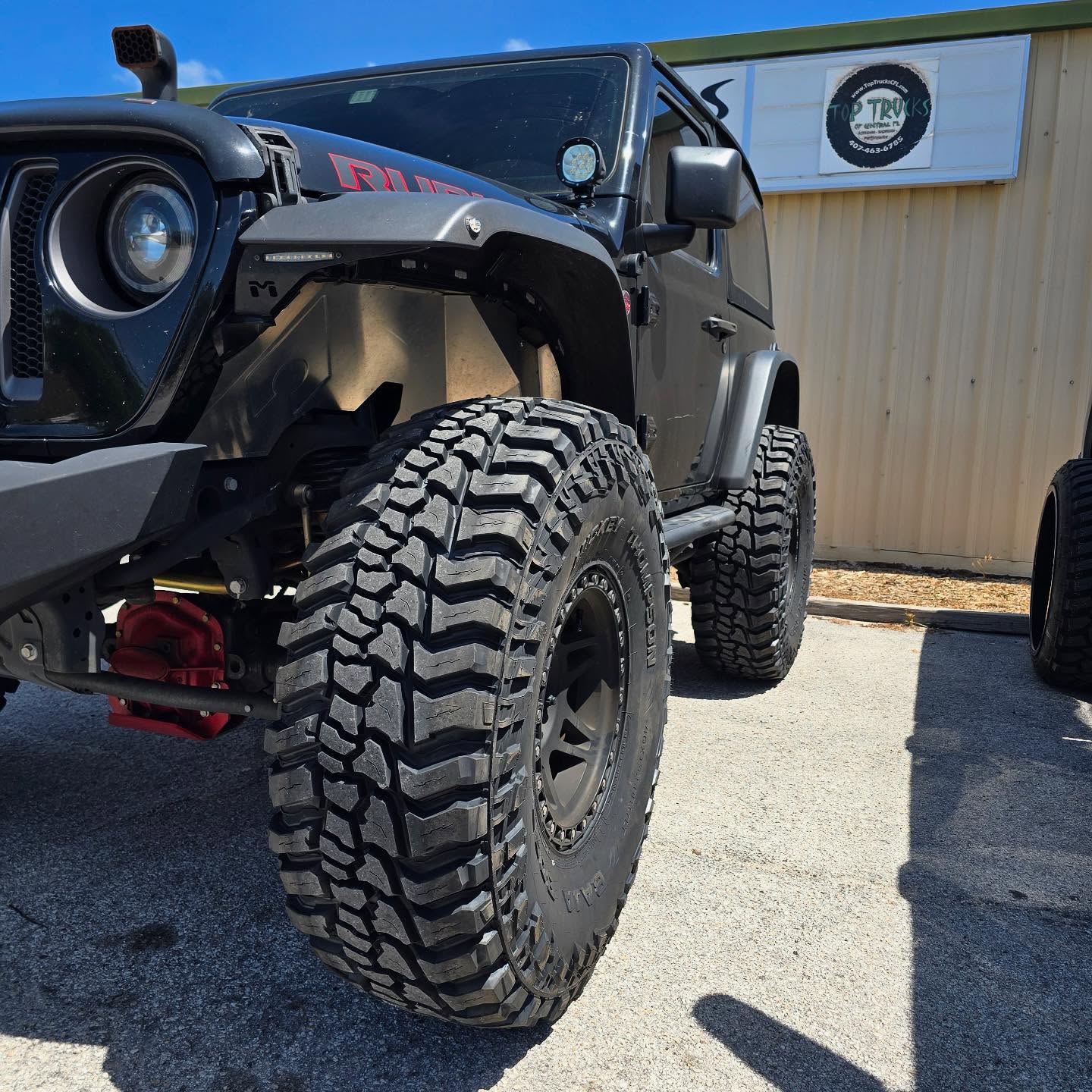 Black Jeep Wrangler on large off-road tires