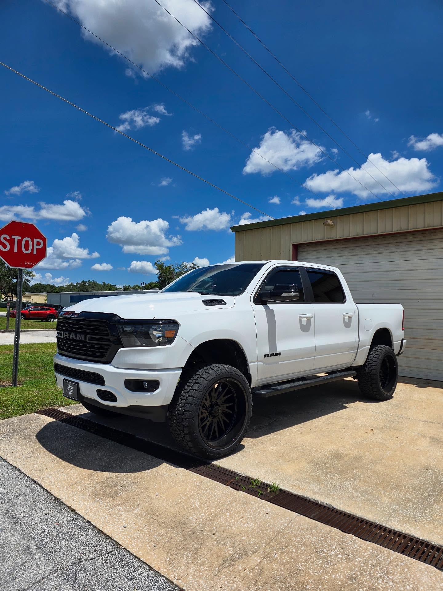 White Ram 1500 outside the Top Trucks shop