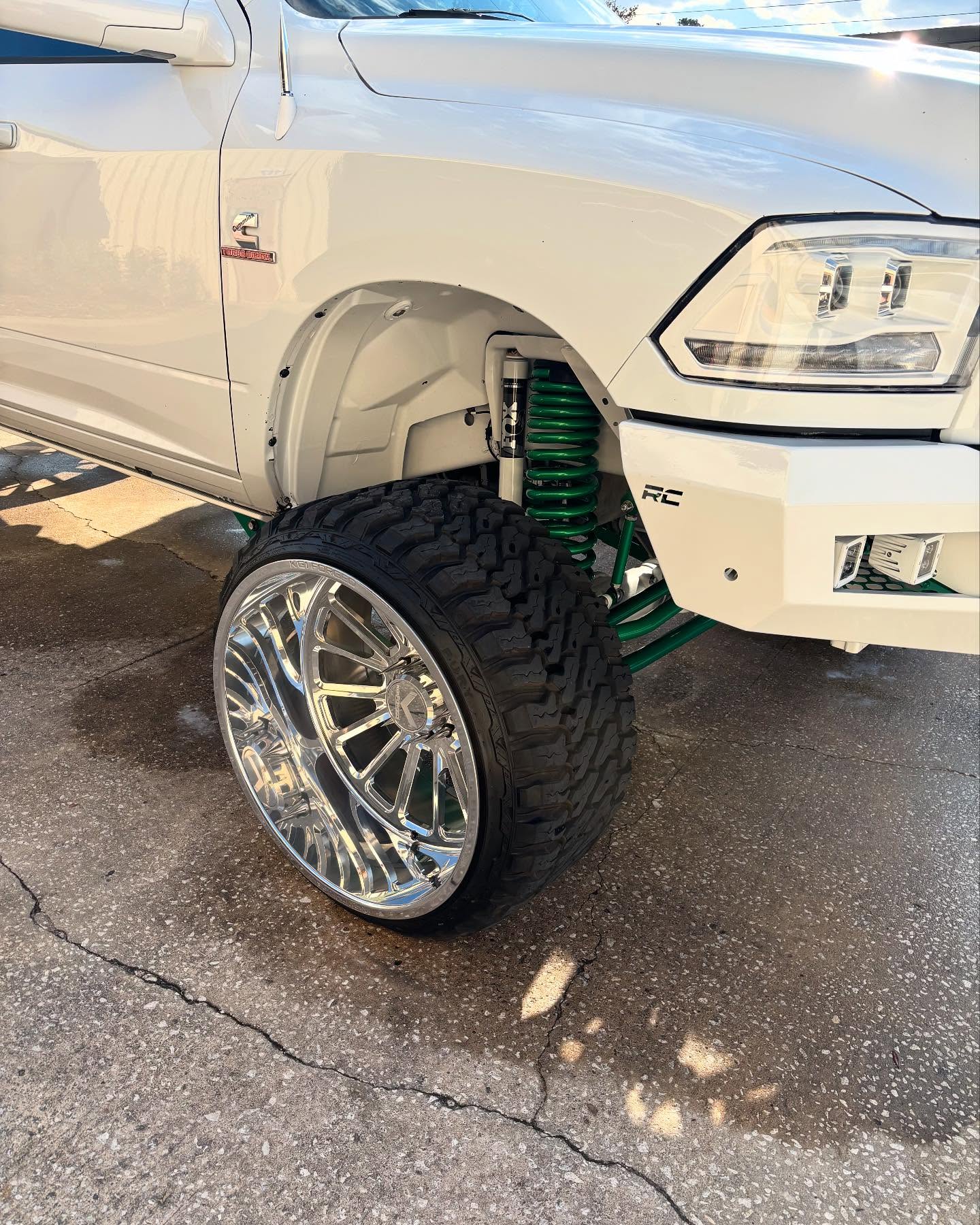 Ram 2500 HD with a Rough Country bumper and lift, built at Top Trucks of Central Florida in Longwood, FL