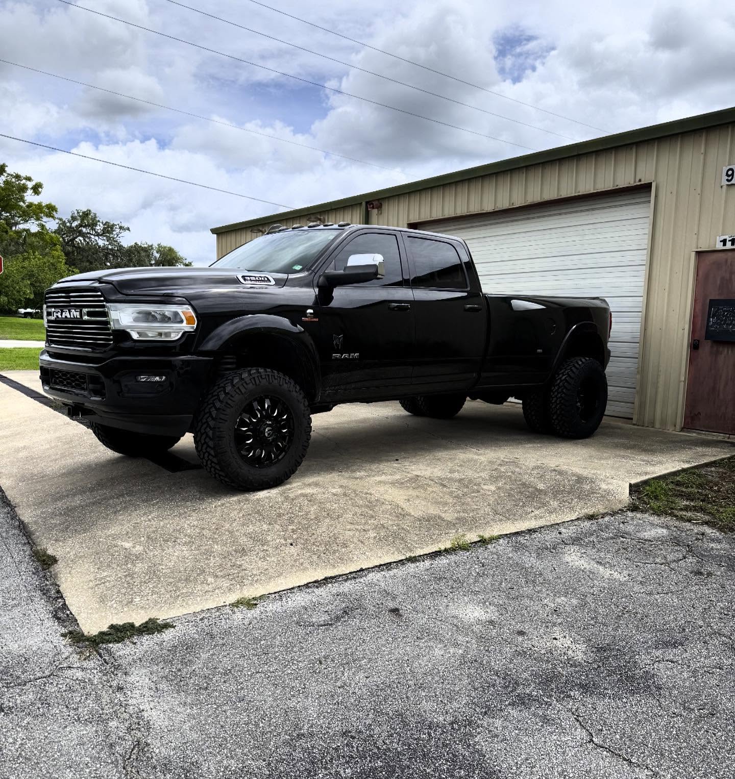 Lifted black Ram 3500 dually, built at Top Trucks of Central Florida in Longwood, FL