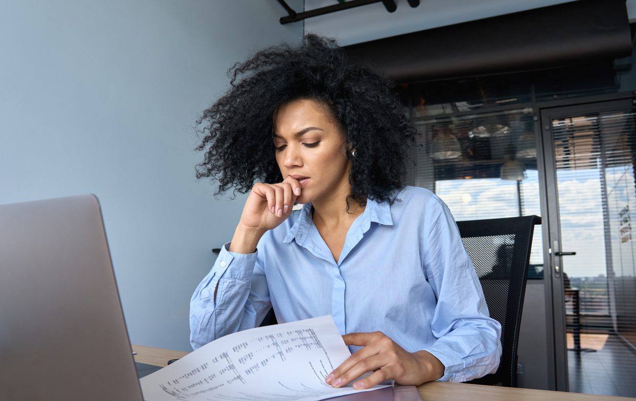 A leader pauses with a hand to her face, weighing the results after a program that worked in the room and faded once the system pulled everyone back