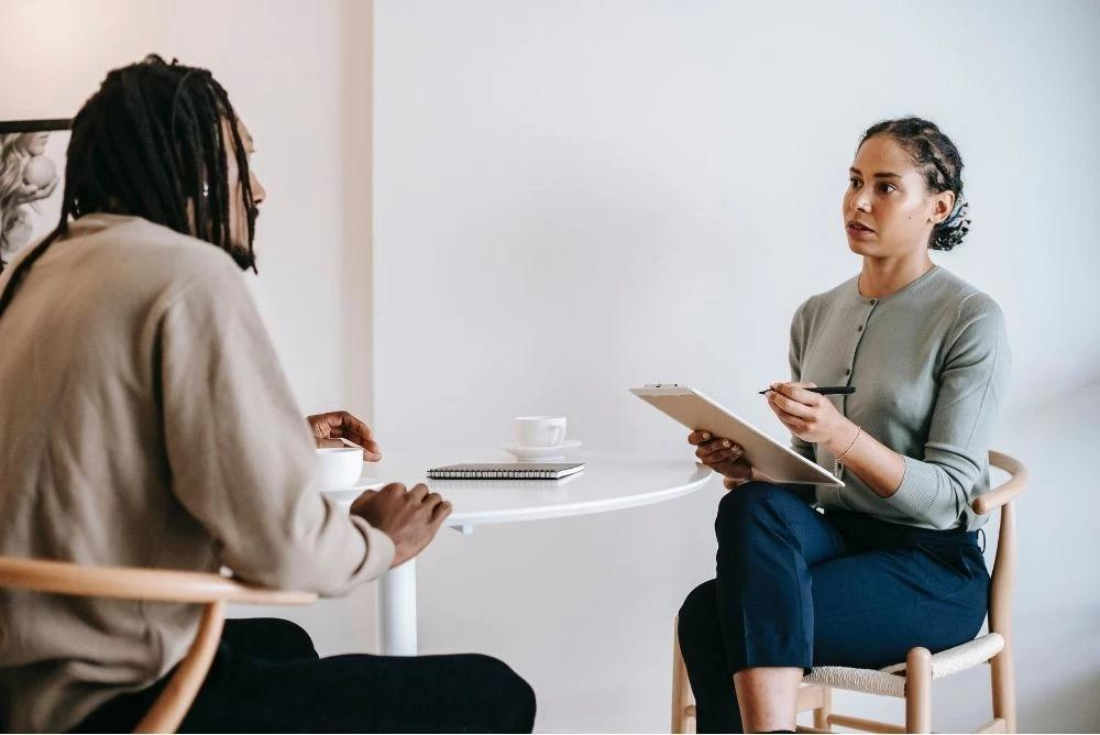 A serious one-on-one conversation, the moment someone raises what is hard to say and waits to see what happens