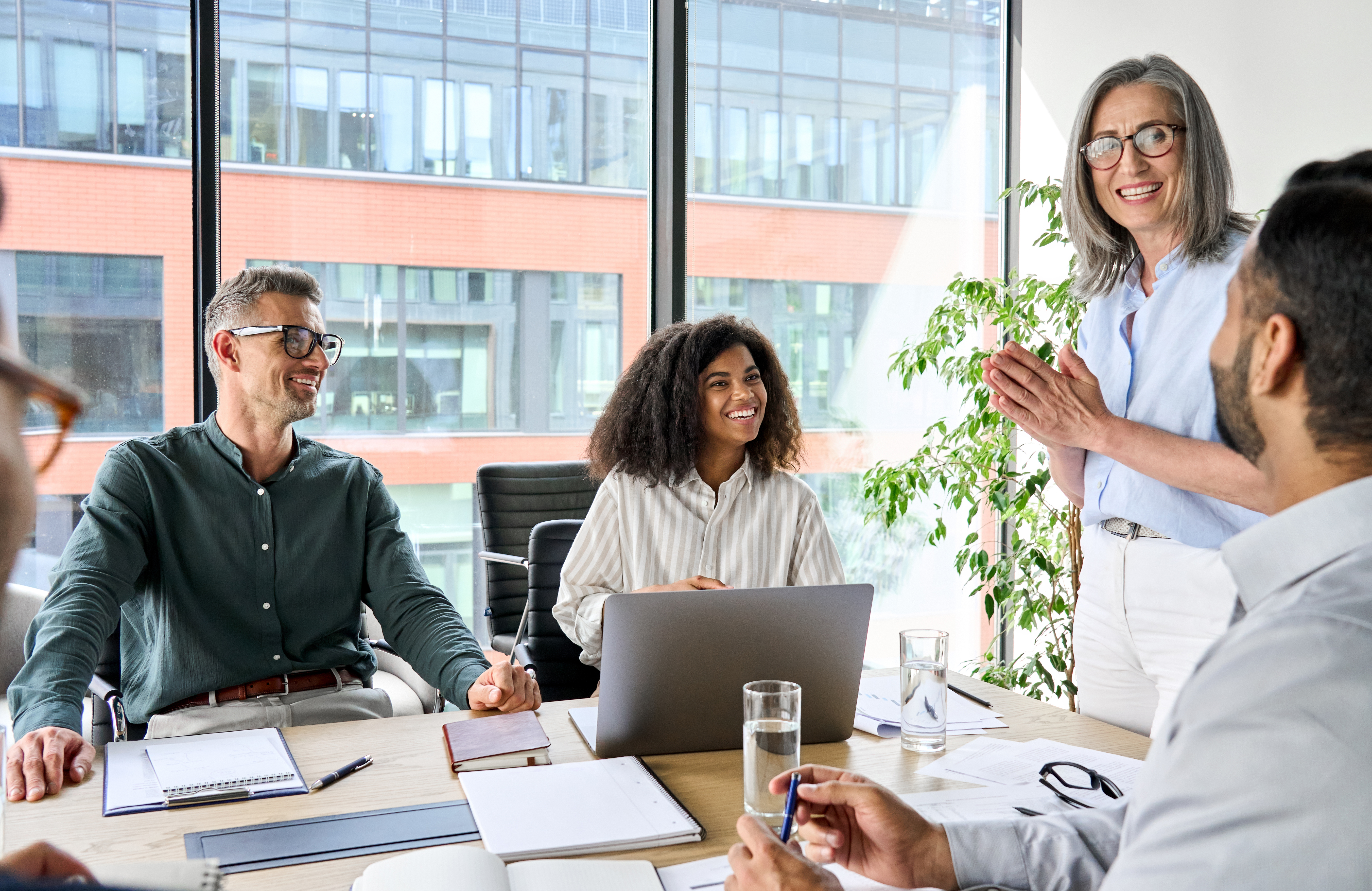 A leader developing a diverse team in a modern workplace