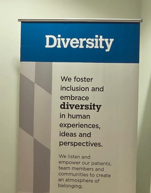 A values banner headed Diversity, hung beside a values wall