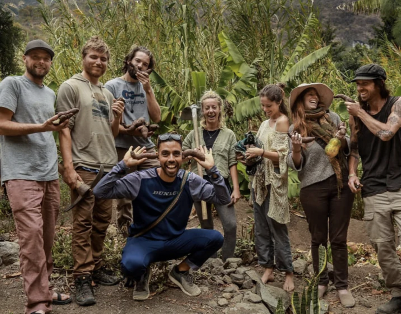 A group of volunteers pose for a picture on a Guatemala permaculture farm.
