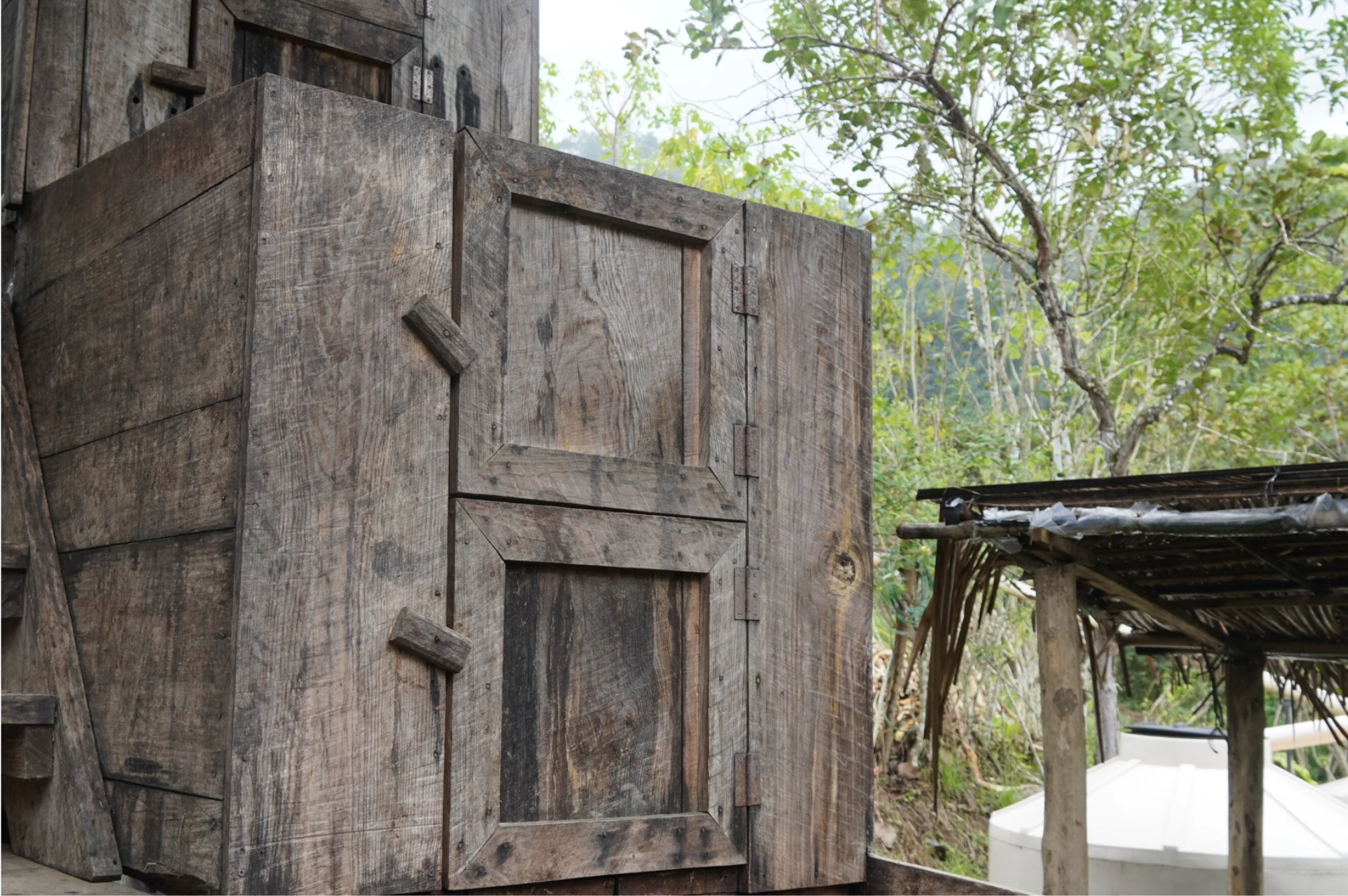 A handmade wooden fermentation boxes for cacao on a chocolate farm in Guatemala