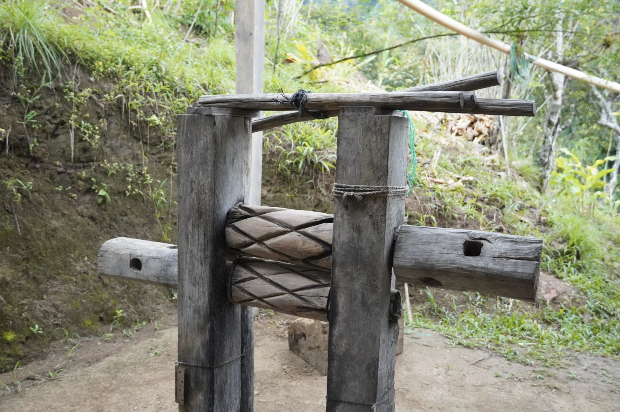 A handmade wooden machine used for cracking cacao seeds during the chocolate making process from bean to bar