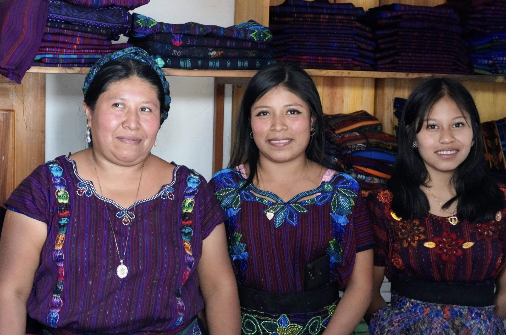Three generations of women working for their small textile business, representing the Microfinance in Latin America