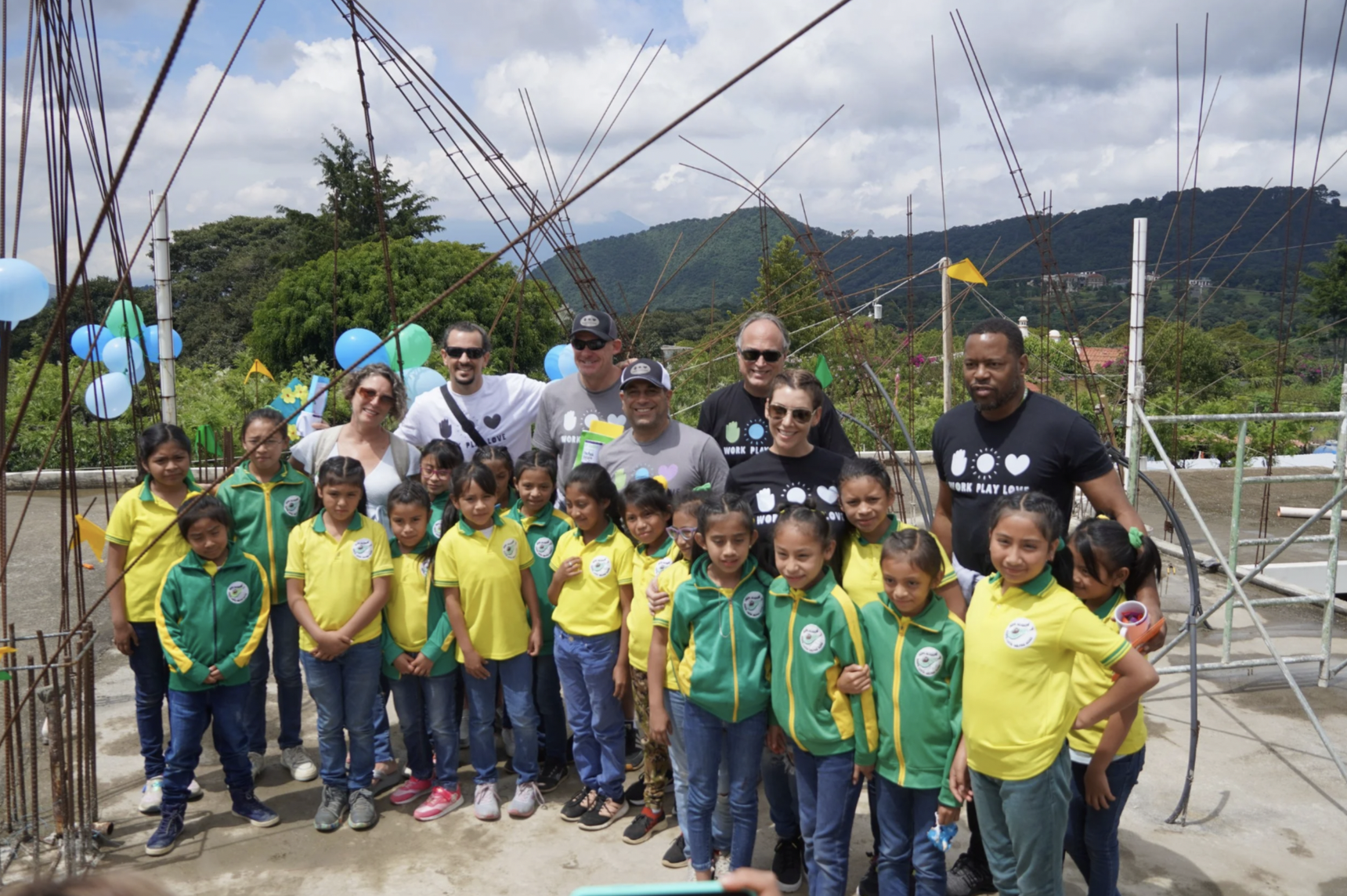 A group of children and adults are together for a photo for an orphanage event for kids and adoption in Guatemala. A group of children and adults are together for a photo for an orphanage event for kids and adoption in Guatemala.
