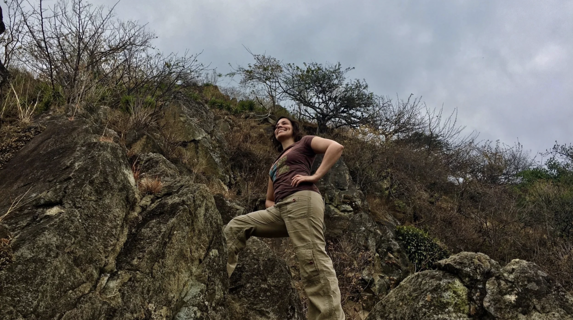 A woman is on a hike in nature, an example of ecotourism in Guatemala