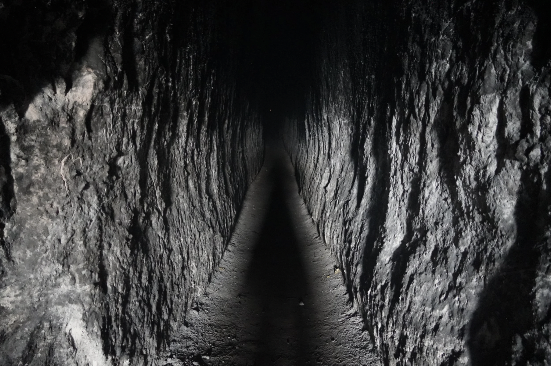 A photo of the entrance to a sacred cave at Mayan cosmology ruins in Guatemala.