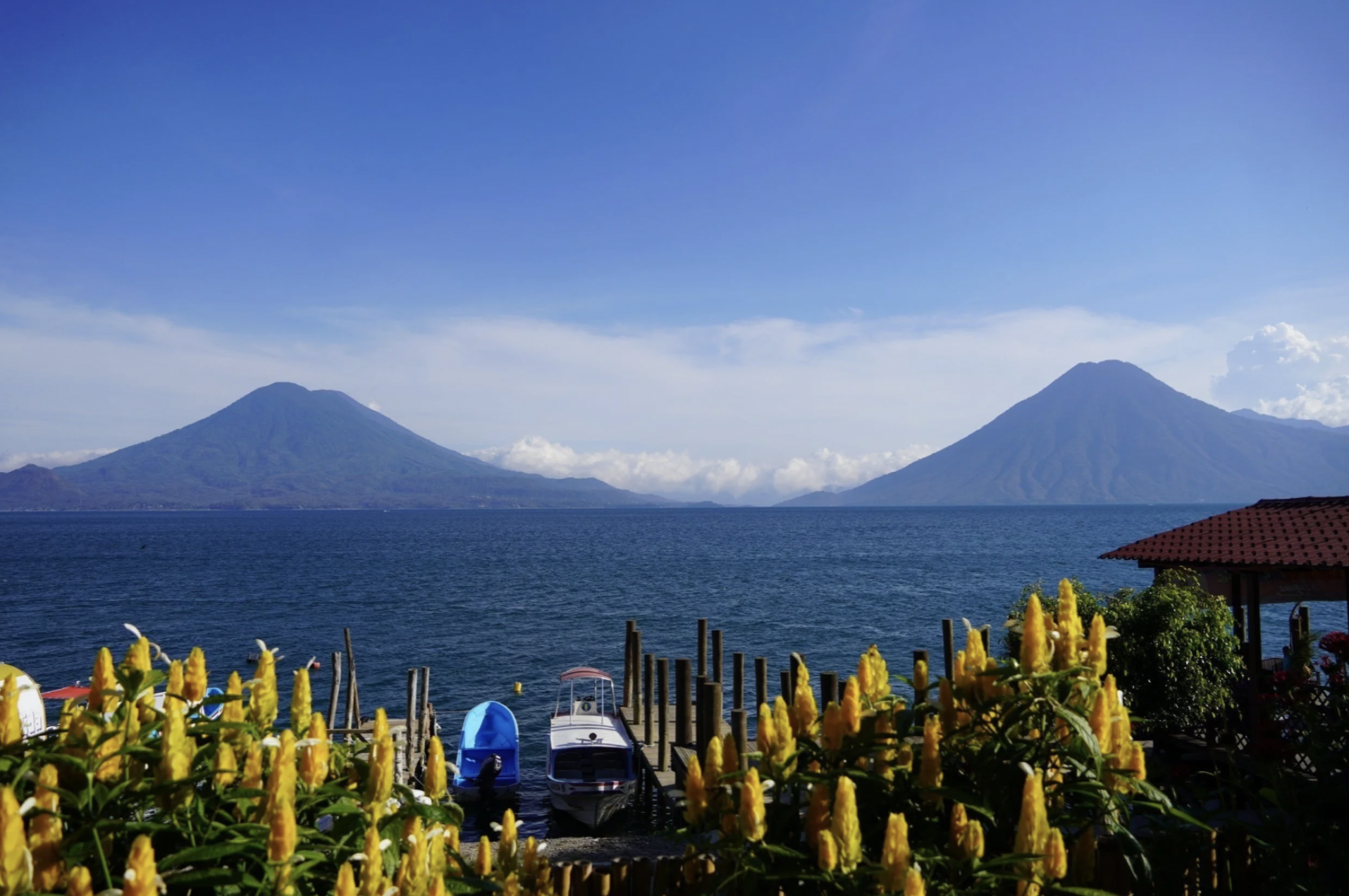 Two towering volcanos surround the beautiful Lake Atitlan in the Guatemalan Highlands